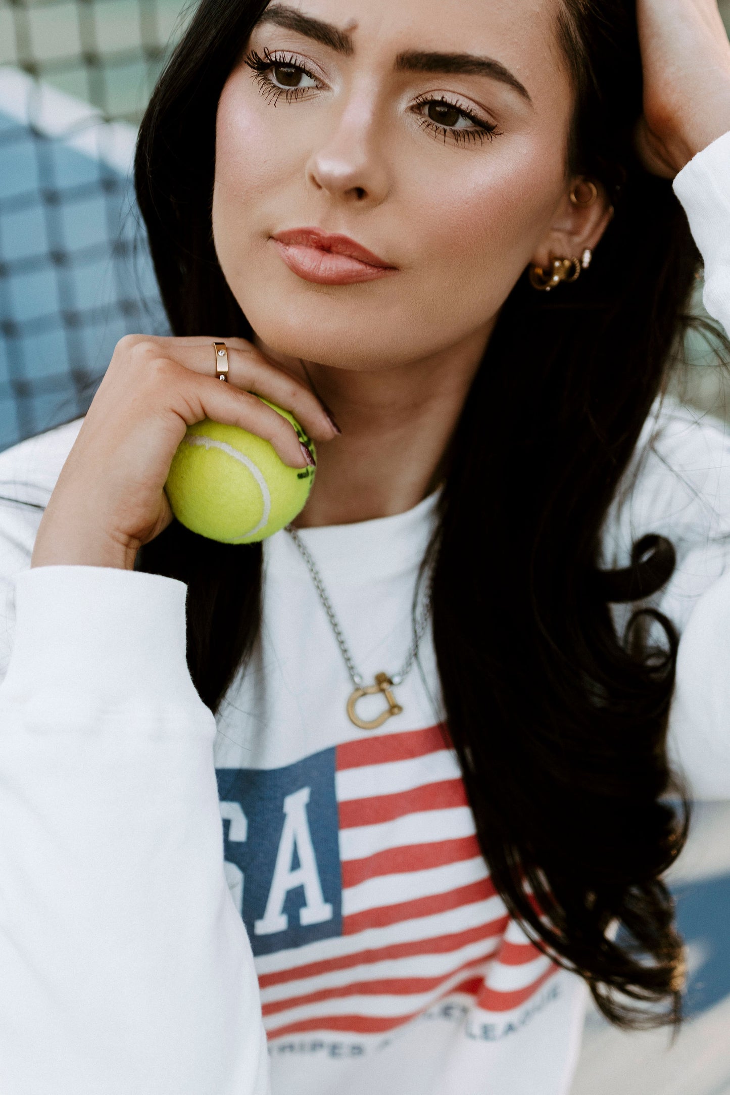 Pippa necklace styled with gold earrings and bracelets for a layered jewelry look