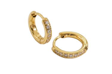 Gold hoop earrings with embedded stones on a light background