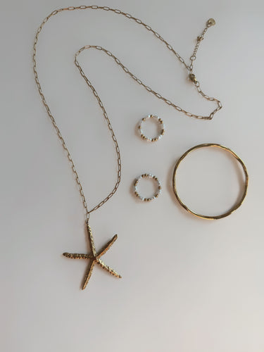 Long Golden Starlet Statement Necklace
