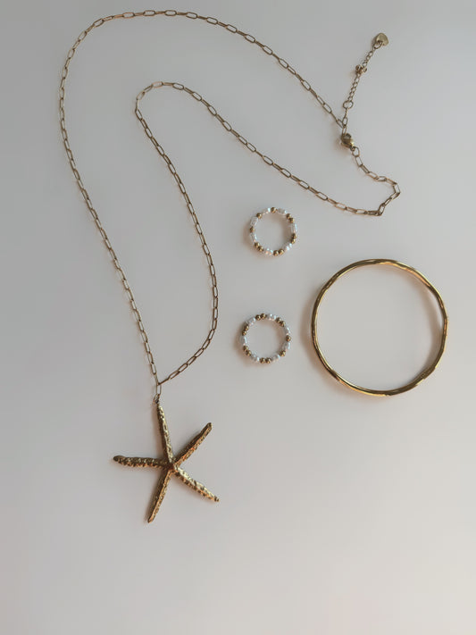 Long Golden Starlet Statement Necklace